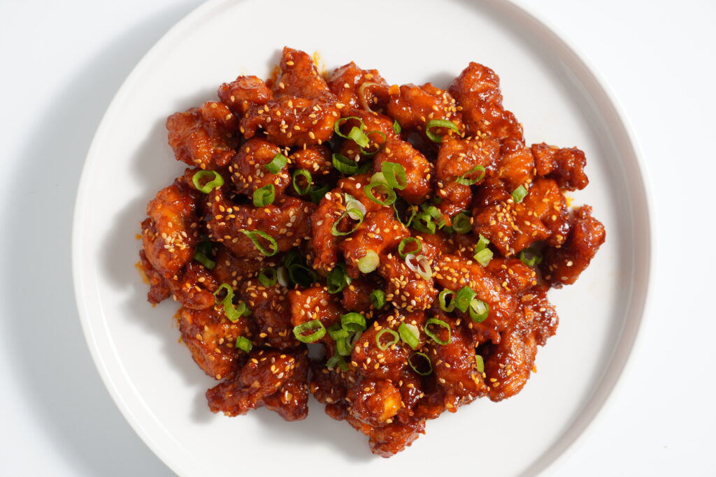 Gochujang Chicken on a round plate